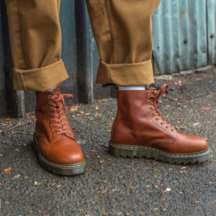 Brown Dr. marten with rolled up cuffs and white socks