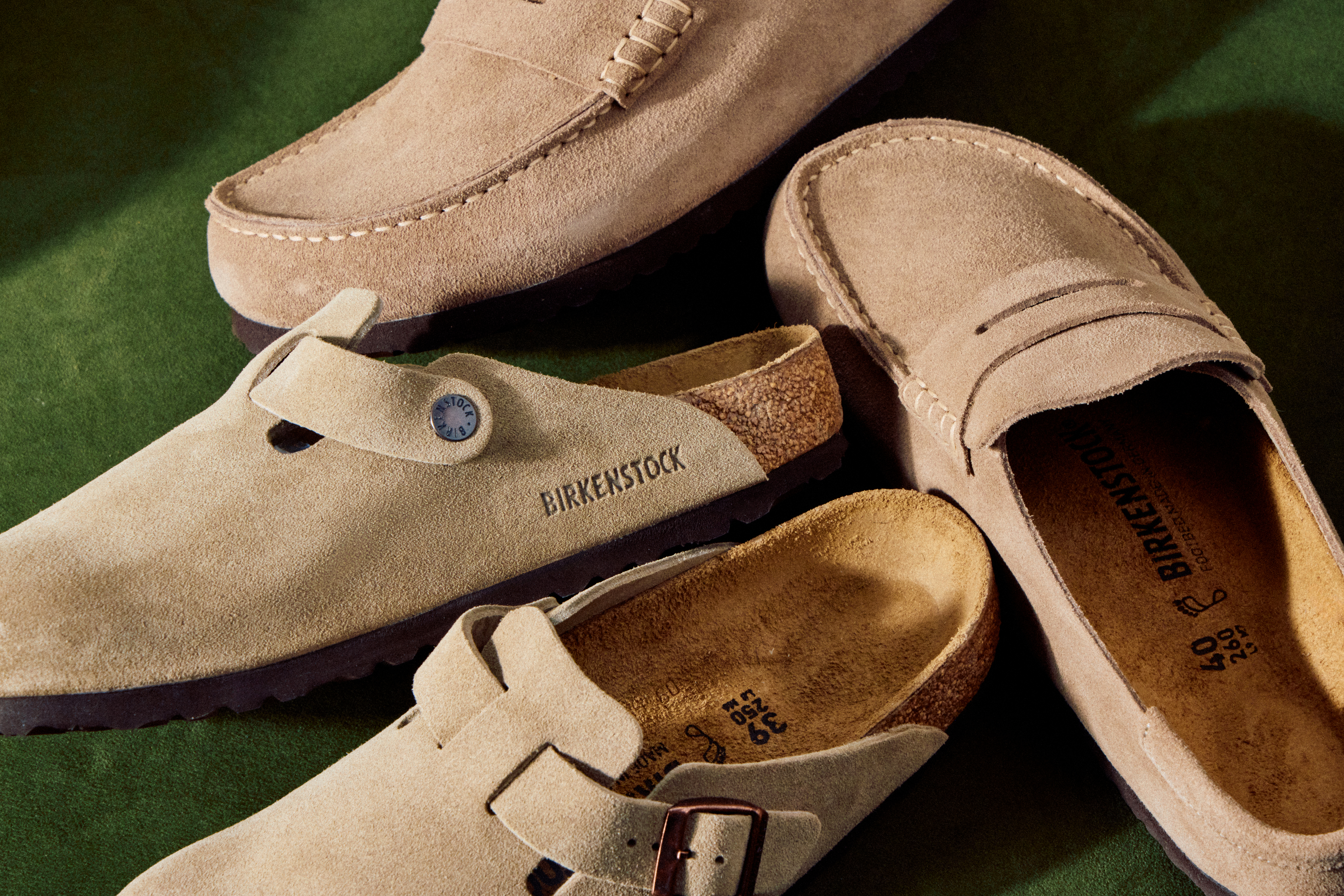 A pair of BIRKENSTOCK Bostons and Naples, both in beige.