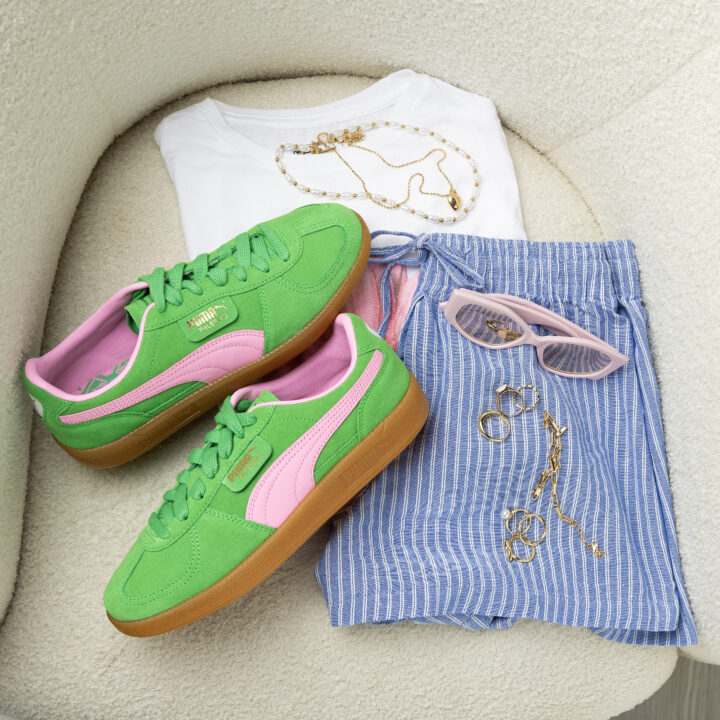 PUMA Palermo in Green and Pink with white tee and blue pin stripe trousers sat on chair