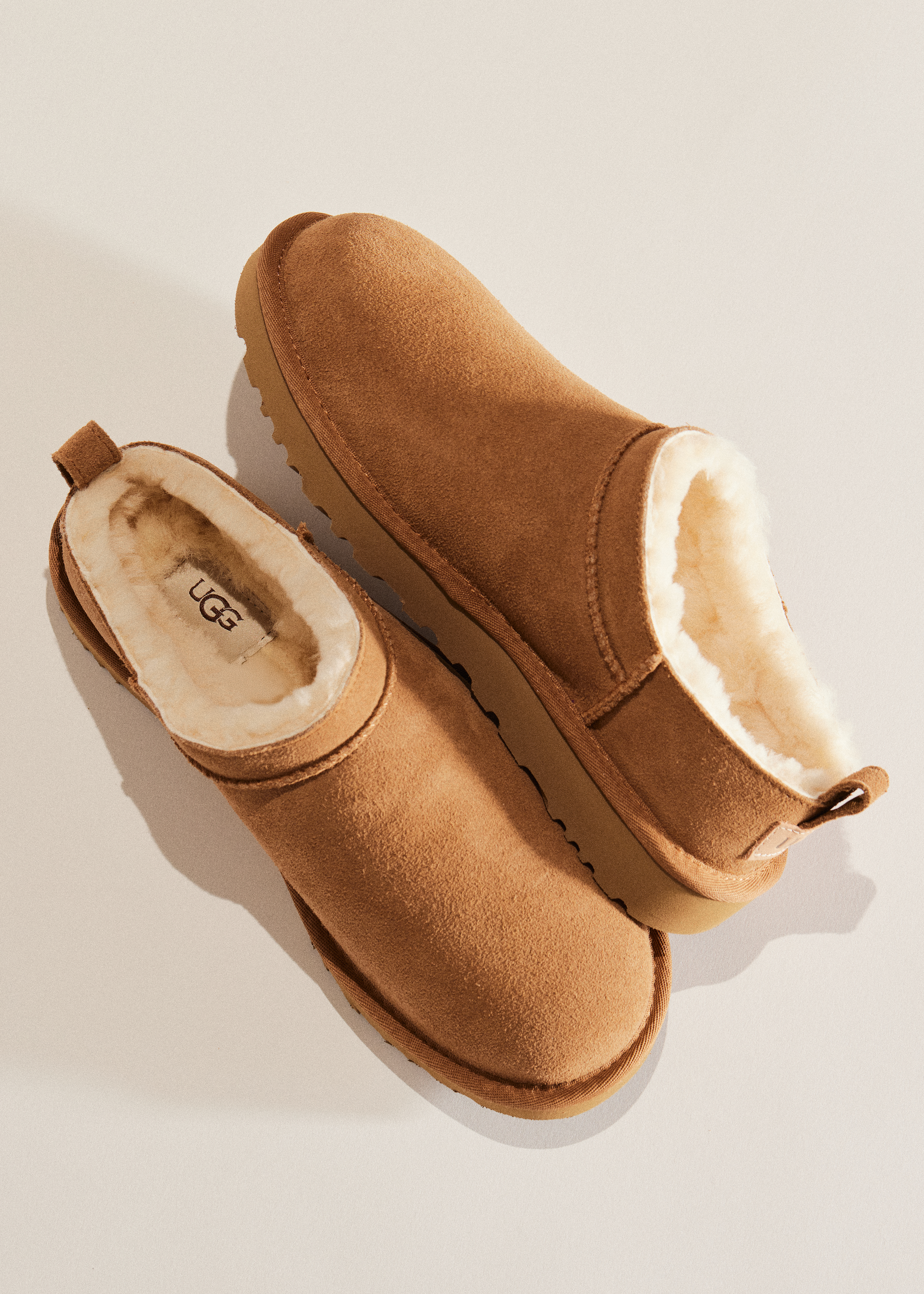 A pair of UGG Classic Ultra Minis in chestnut.