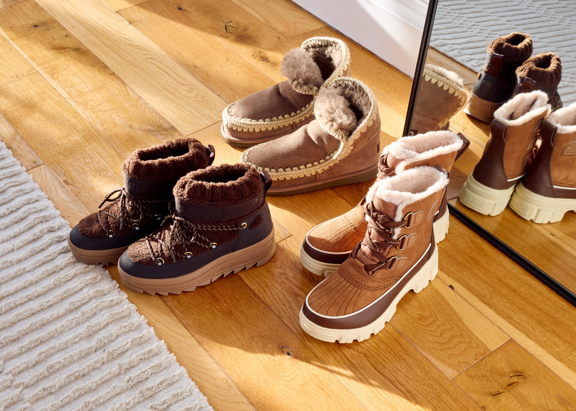 The PAJAR Galaxy Mini Sherpa Snow in dark brown, MOU Eskimo 18 in taupe, and SOREL Torino in brown.