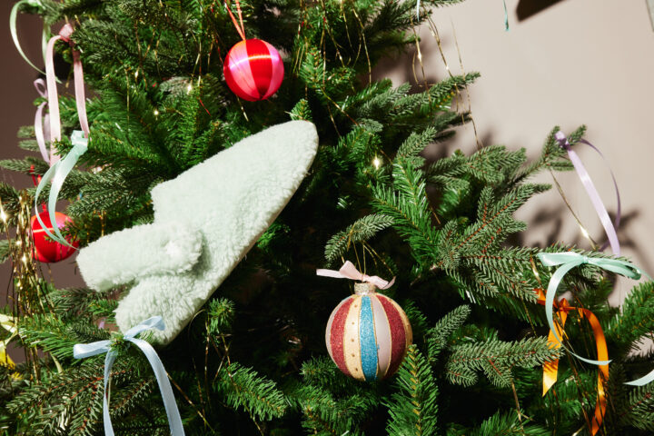 Green Crocs Cozzzy in a Christmas tree.