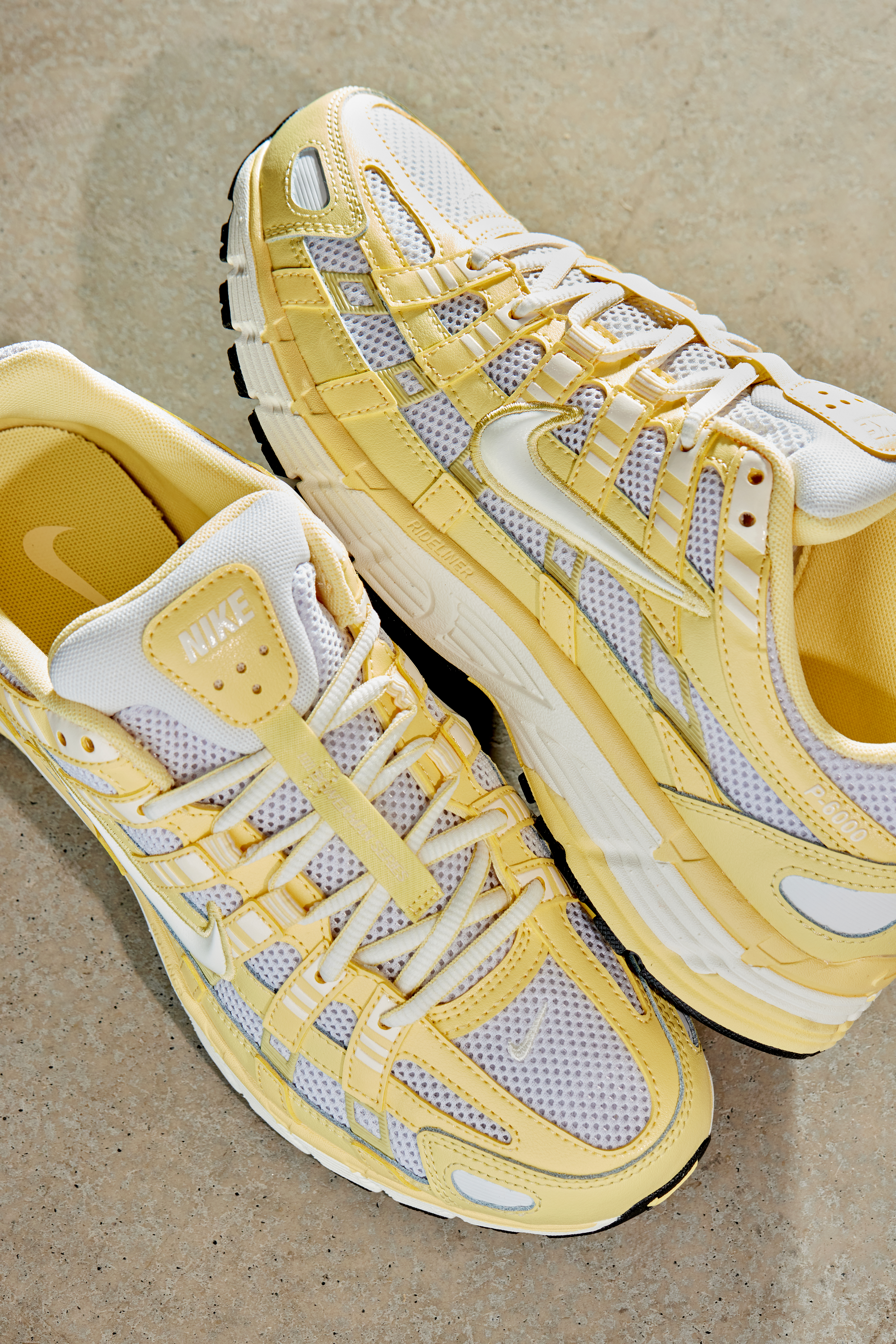 A pair of Nike P-6000 in yellow and white.