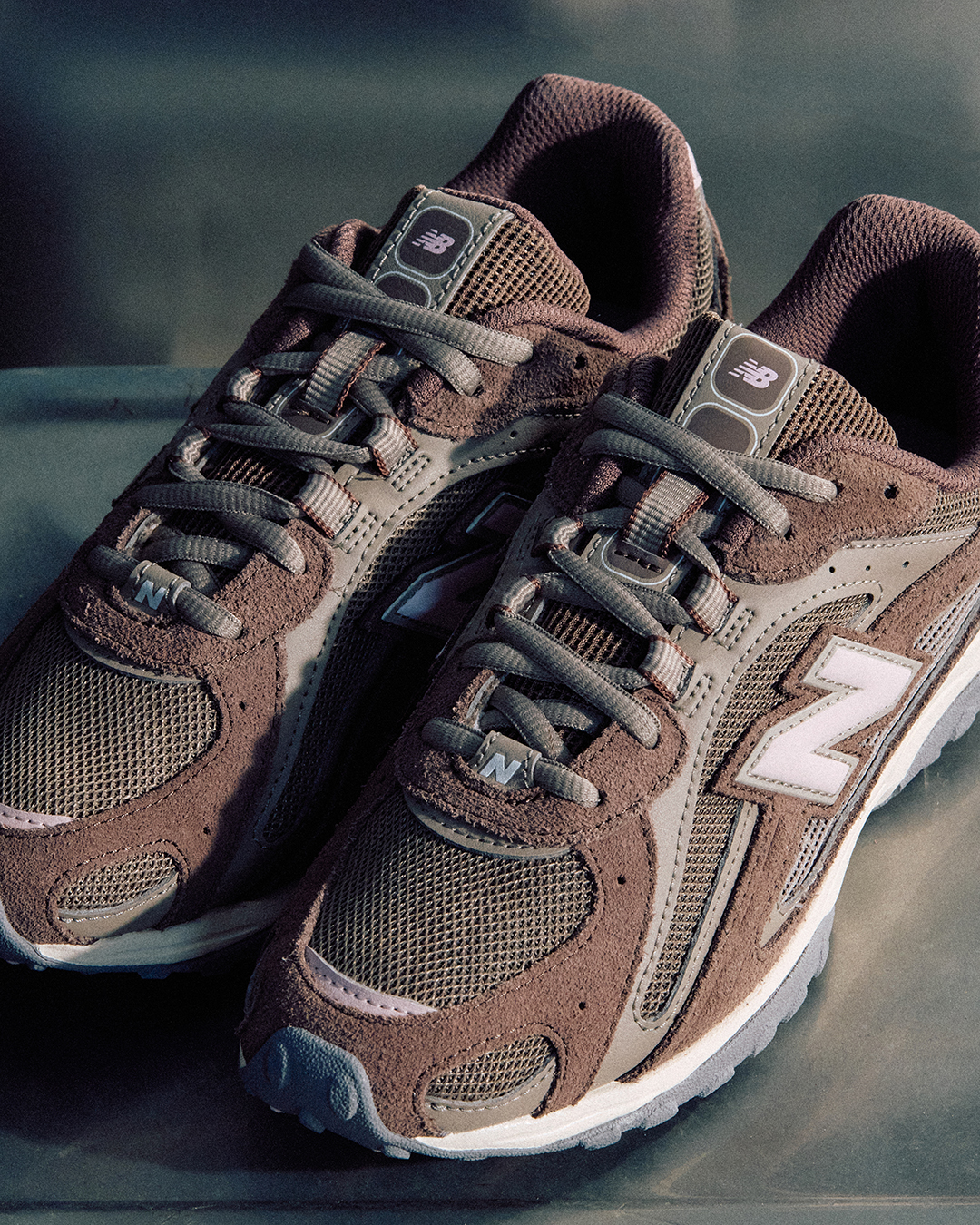 A pair of brown New Balance 204Ls.