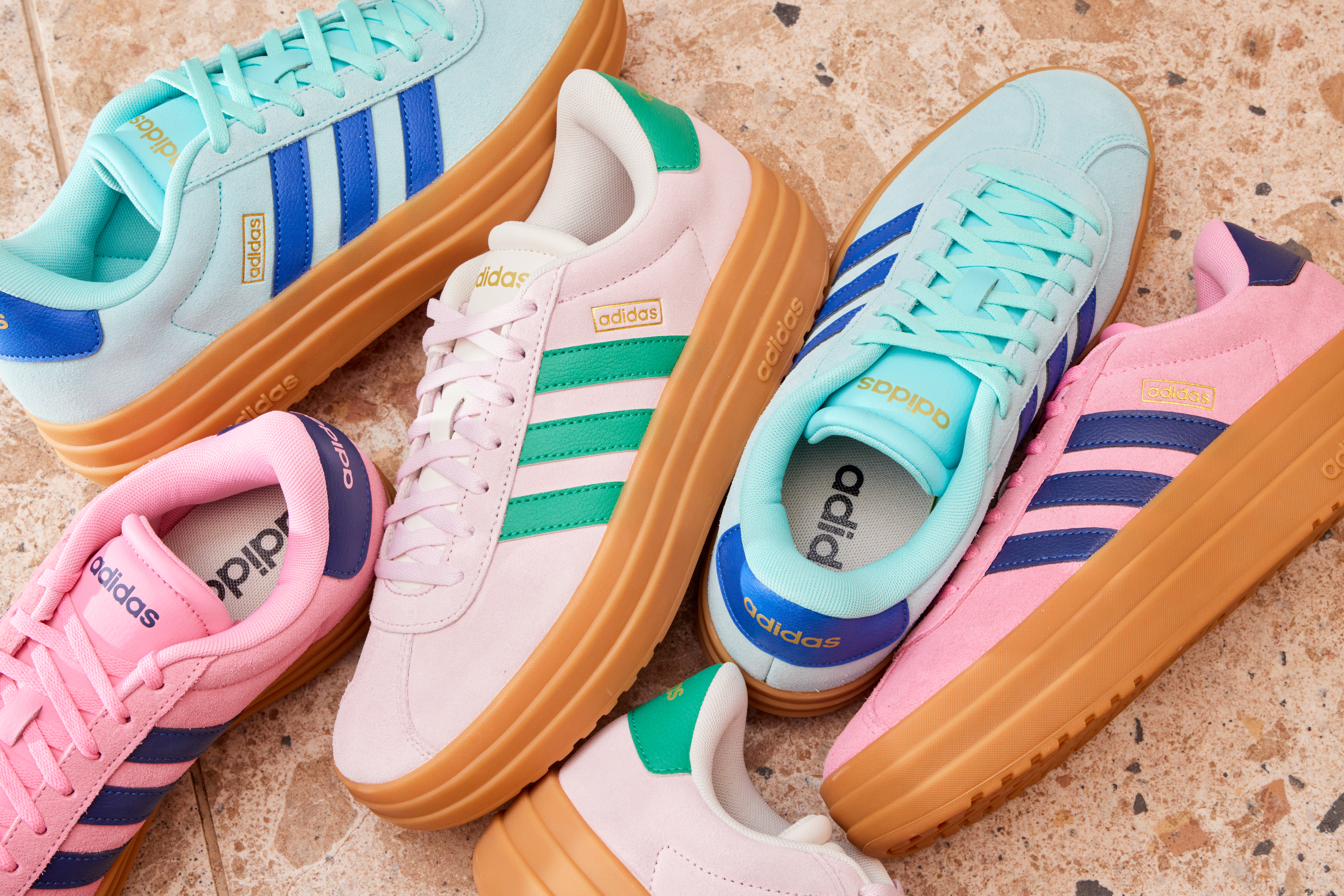 A few pairs of adidas Gazelle Bold in different colourways, including blue, pink and green, and pink and blue.