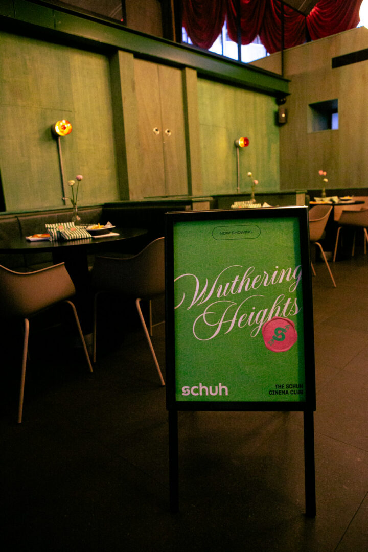 A sign reading 'Now Showing: Wuthering Heights, The schuh Cinema Club'