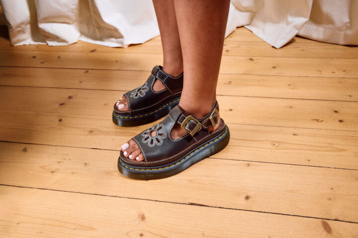 Person wearing the Dr. Martens Dunnet Flower sandals in brown.
