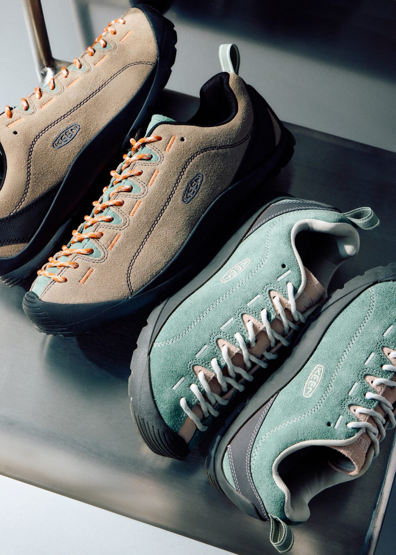 Two pairs of KEEN Jasper: one in beige and one in green.